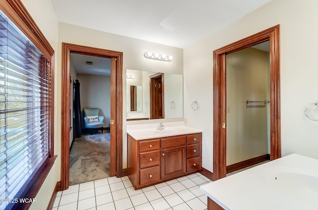 bathroom with tile patterned flooring and vanity