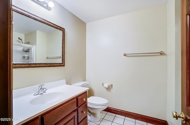 bathroom featuring vanity, toilet, an enclosed shower, and tile patterned flooring