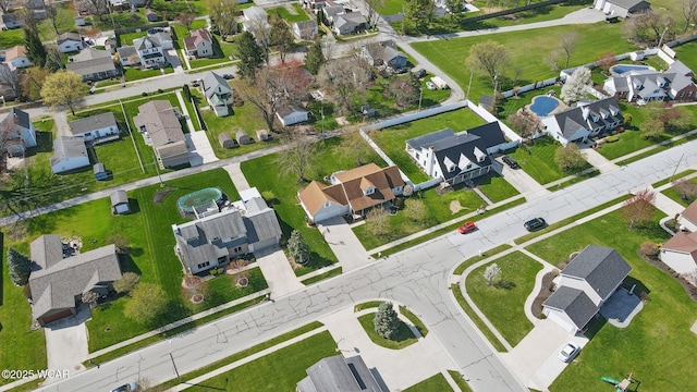 birds eye view of property with a residential view