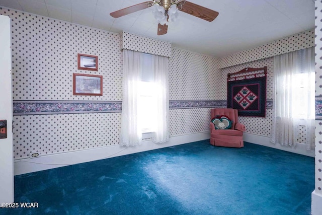 315 W Main St, Cairo, OH 45820 - unfurnished room with wallpapered walls, carpet floors, and ceiling fan