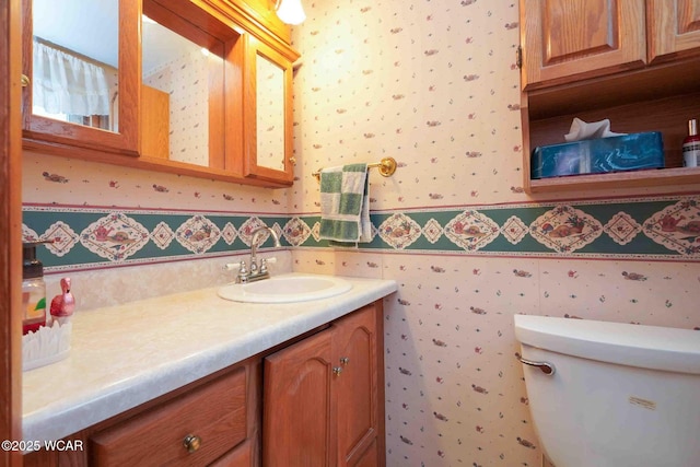 315 W Main St, Cairo, OH 45820 - bathroom featuring wallpapered walls, vanity, and toilet