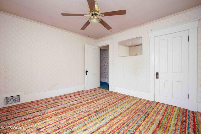 315 W Main St, Cairo, OH 45820 - spare room with ornamental molding, a ceiling fan, carpet, and wallpapered walls
