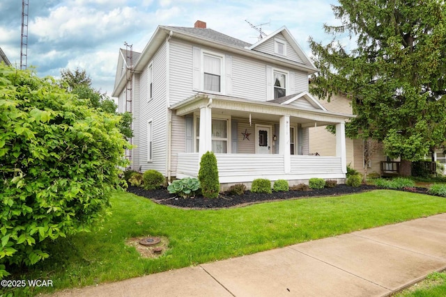 315 W Main St, Cairo, OH 45820 - american foursquare style home with covered porch, a chimney, and a front yard