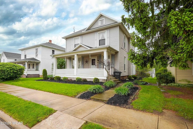 315 W Main St, Cairo, OH 45820 - american foursquare style home with covered porch and a front lawn