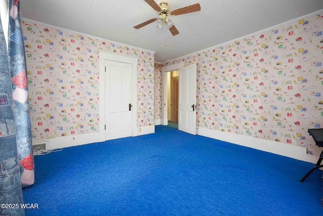 315 W Main St, Cairo, OH 45820 - unfurnished bedroom featuring wallpapered walls, crown molding, a ceiling fan, and a closet