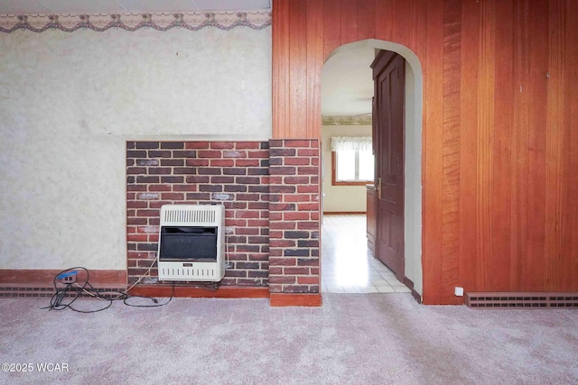 315 W Main St, Cairo, OH 45820 - hallway featuring heating unit, arched walkways, and carpet