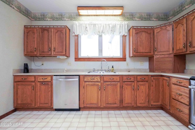 315 W Main St, Cairo, OH 45820 - kitchen featuring dishwasher, a sink, brown cabinets, and light countertops