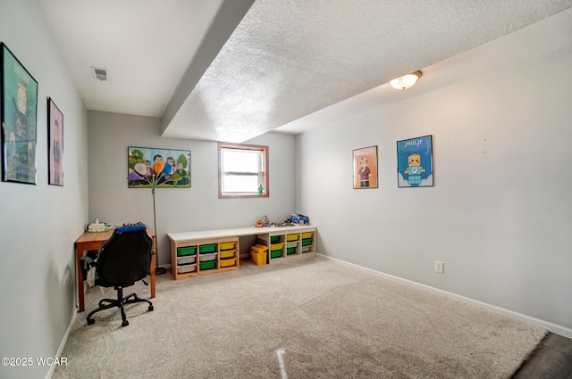 game room with visible vents, a textured ceiling, baseboards, and carpet floors