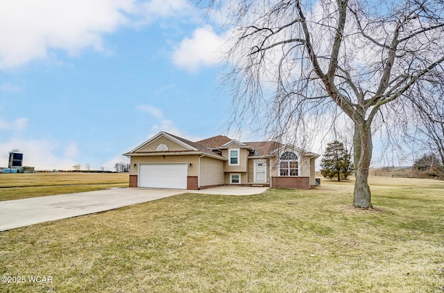 tri-level home with a front lawn, an attached garage, brick siding, and driveway