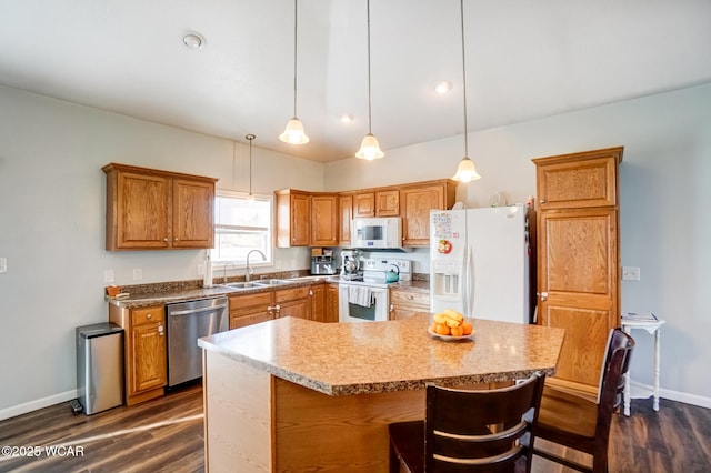kitchen featuring white appliances, dark wood-style floors, baseboards, and a sink