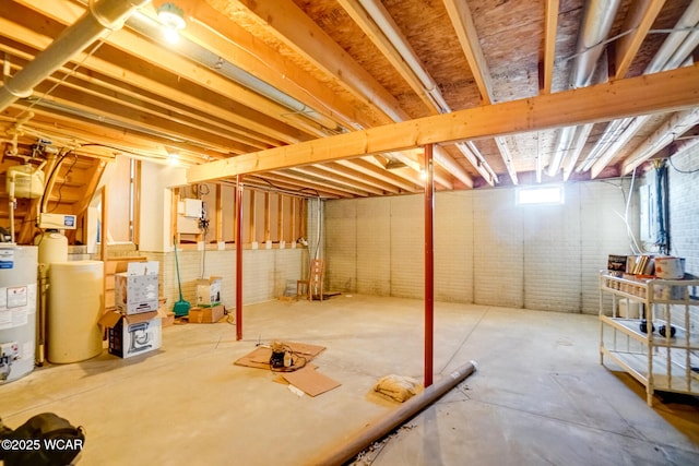 below grade area with brick wall and water heater