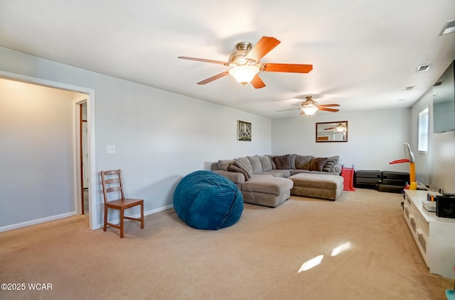 carpeted living area featuring visible vents, baseboards, and a ceiling fan