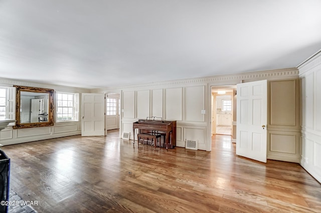 unfurnished living room featuring wood-type flooring