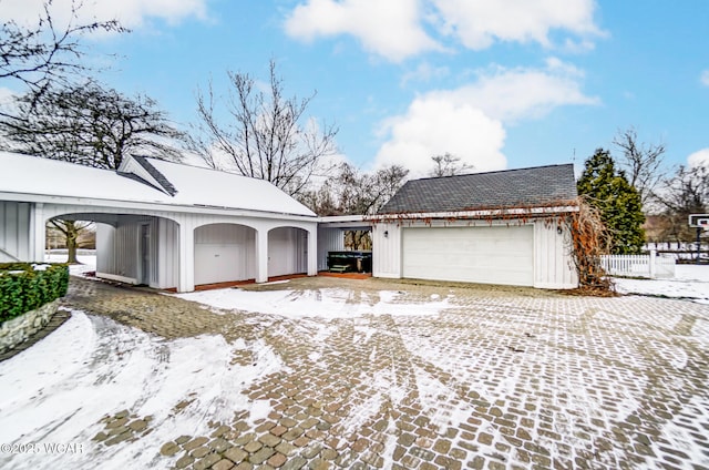 view of front of house with a garage and an outdoor structure