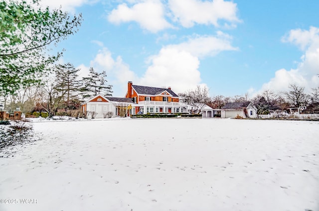 view of yard layered in snow