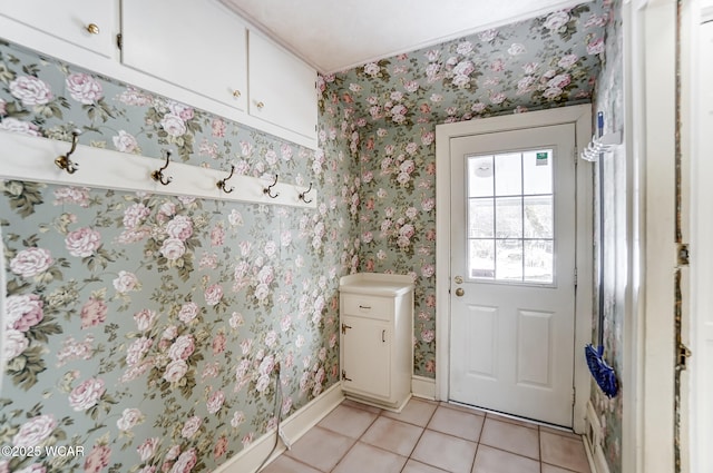 doorway to outside featuring light tile patterned flooring