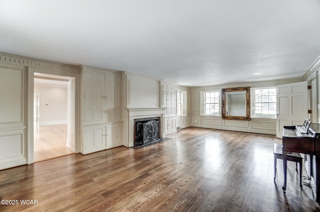 unfurnished living room with wood-type flooring