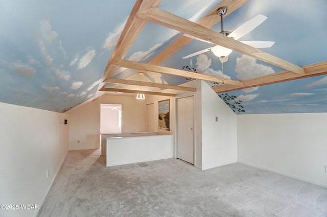 unfurnished living room featuring lofted ceiling with beams, light carpet, and ceiling fan