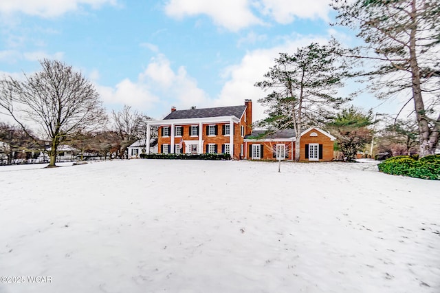 view of snow covered house