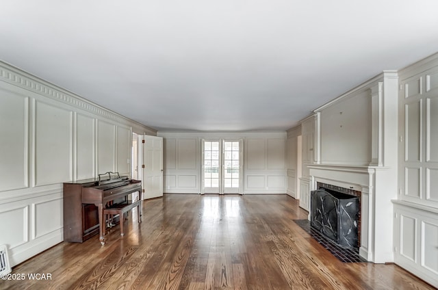 living room featuring dark hardwood / wood-style flooring and a fireplace