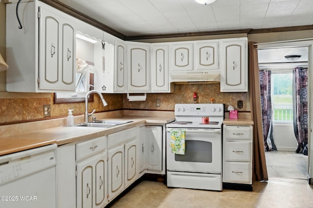 1398 Lutz Rd, Lima, OH 45801 - kitchen featuring white appliances, backsplash, light countertops, and under cabinet range hood