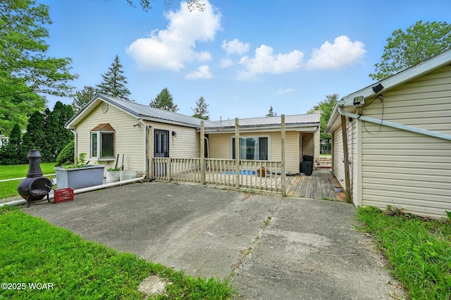 1398 Lutz Rd, Lima, OH 45801 - view of front of house featuring metal roof and a wooden deck