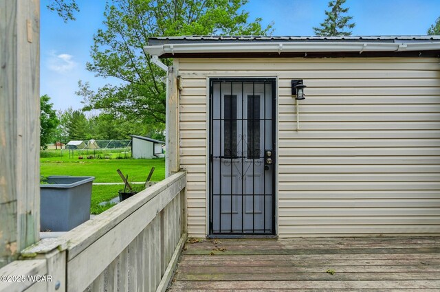 1398 Lutz Rd, Lima, OH 45801 - property entrance with a yard and metal roof