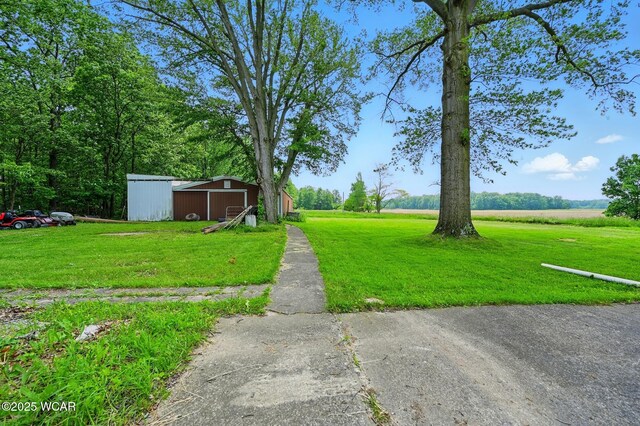 1398 Lutz Rd, Lima, OH 45801 - view of grassy yard featuring a pole building and an outbuilding