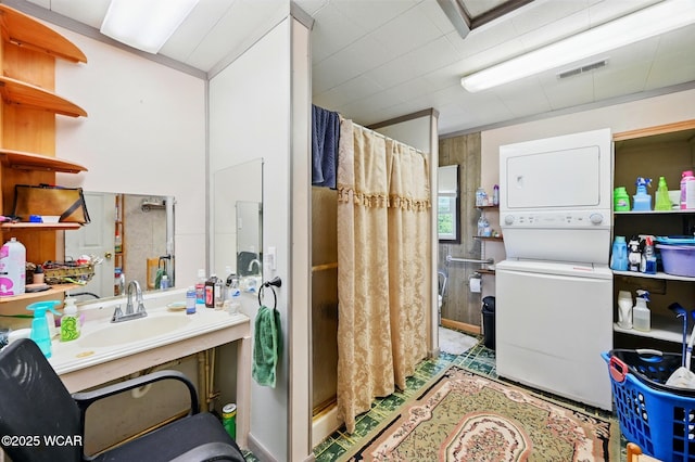 1398 Lutz Rd, Lima, OH 45801 - full bathroom with stacked washer / dryer, a shower stall, and vanity