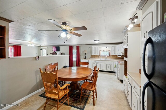 1398 Lutz Rd, Lima, OH 45801 - dining space featuring a ceiling fan and baseboards