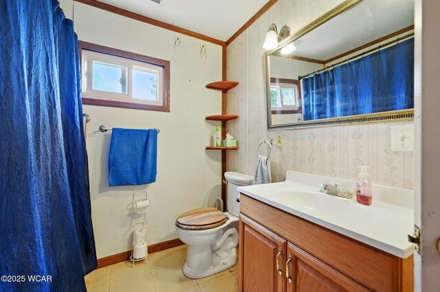 1398 Lutz Rd, Lima, OH 45801 - full bathroom featuring vanity, toilet, baseboards, ornamental molding, and tile patterned flooring
