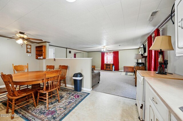 1398 Lutz Rd, Lima, OH 45801 - dining area featuring ceiling fan, baseboards, and light floors