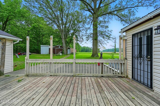 1398 Lutz Rd, Lima, OH 45801 - deck with a lawn and an outbuilding