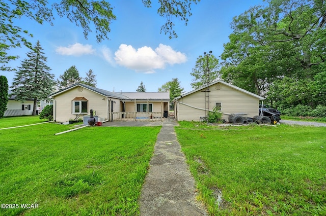 1398 Lutz Rd, Lima, OH 45801 - ranch-style home with a front yard and covered porch