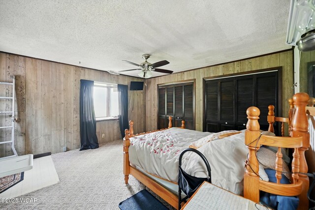 1398 Lutz Rd, Lima, OH 45801 - bedroom with wooden walls, a textured ceiling, carpet flooring, and ceiling fan