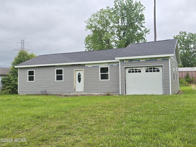 4883 S Dixie Hwy, Lima, OH 45806 - view of front facade featuring a garage, a front yard, and roof with shingles