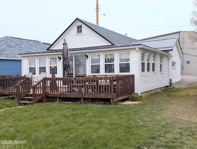 127 Brads Way, Russells Point, OH 43348 - back of house featuring a deck, a lawn, and metal roof