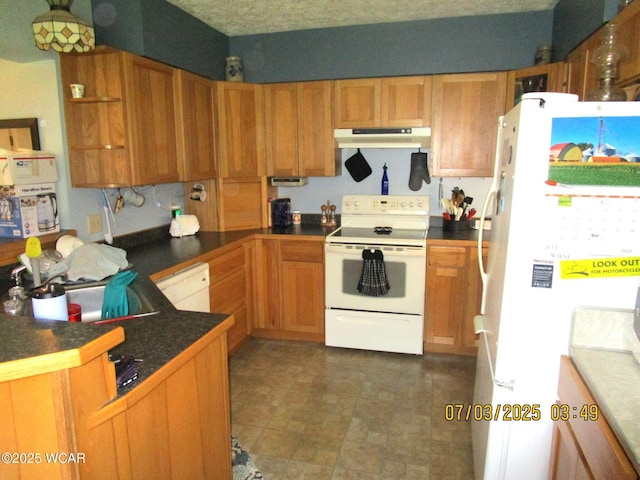 514 S Wayne St, Kenton, OH 43326 - kitchen with white appliances, under cabinet range hood, dark countertops, open shelves, and brown cabinets