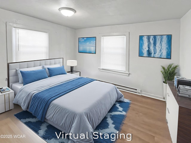 556 Cortlandt Ave, Lima, OH 45801 - bedroom featuring wood finished floors and a baseboard radiator