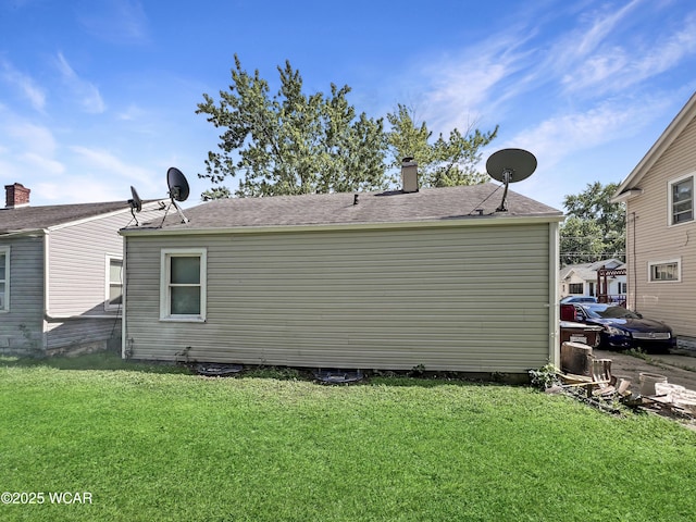556 Cortlandt Ave, Lima, OH 45801 - view of home's exterior featuring a yard and a chimney