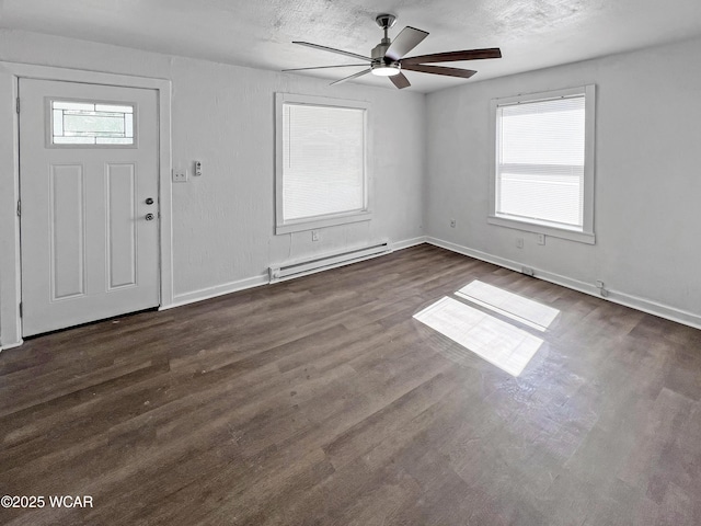 556 Cortlandt Ave, Lima, OH 45801 - foyer with baseboard heating, ceiling fan, and dark wood-style flooring
