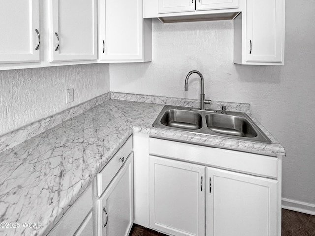 556 Cortlandt Ave, Lima, OH 45801 - kitchen featuring white cabinetry and light countertops