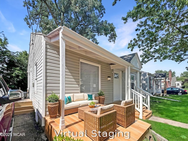 556 Cortlandt Ave, Lima, OH 45801 - wooden deck with an outdoor living space and a lawn