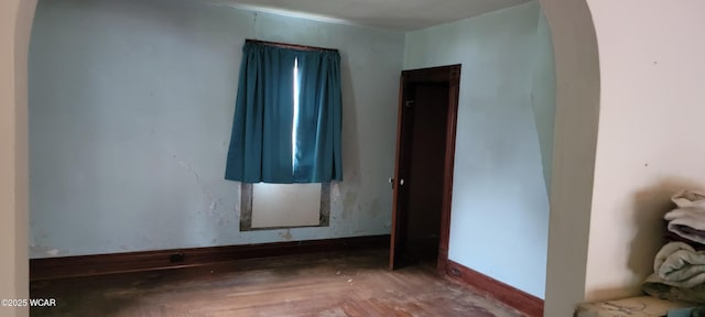 spare room with hardwood / wood-style flooring