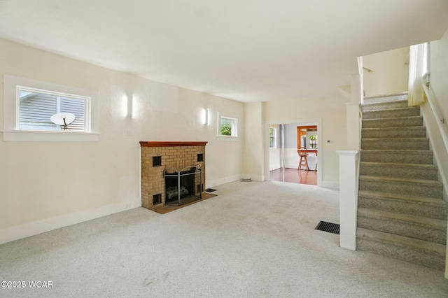 510 N Walnut St, Van Wert, OH 45891 - unfurnished living room with carpet flooring, stairs, and a fireplace