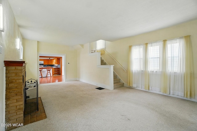 510 N Walnut St, Van Wert, OH 45891 - unfurnished living room with carpet and stairs