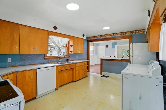 510 N Walnut St, Van Wert, OH 45891 - kitchen with white appliances, light floors, light countertops, and tasteful backsplash