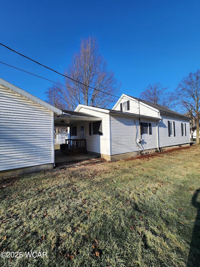 view of home's exterior with a yard