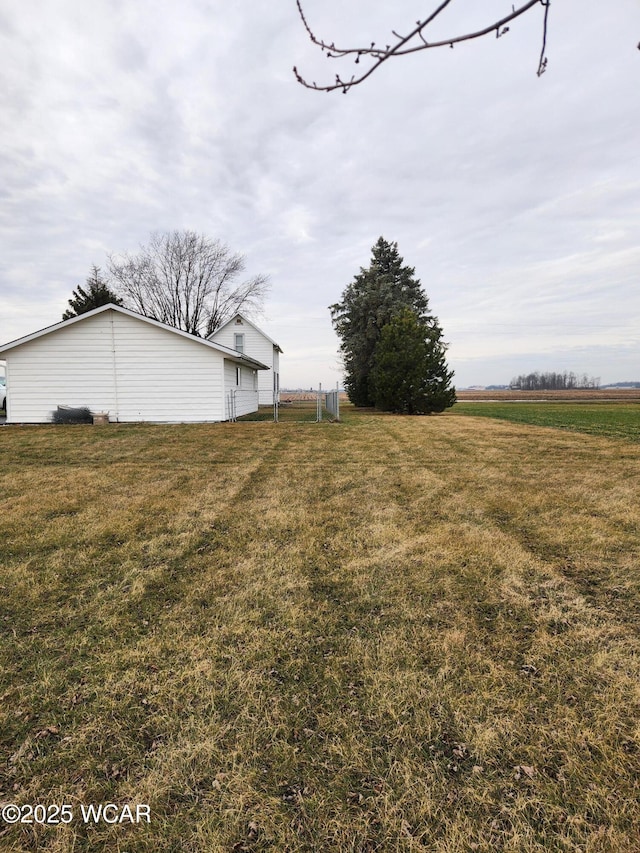 view of yard with a rural view