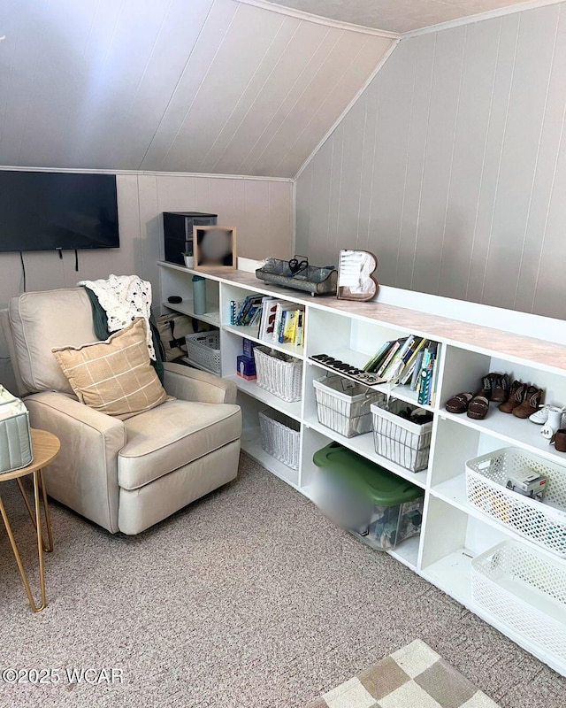 living area with vaulted ceiling and carpet floors